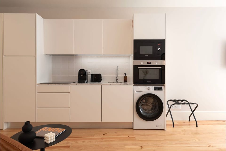 Discover the art of culinary convenience in this compact yet fully-equipped kitchenette. Designed for efficiency without sacrificing style, this space is a testament to modern living.