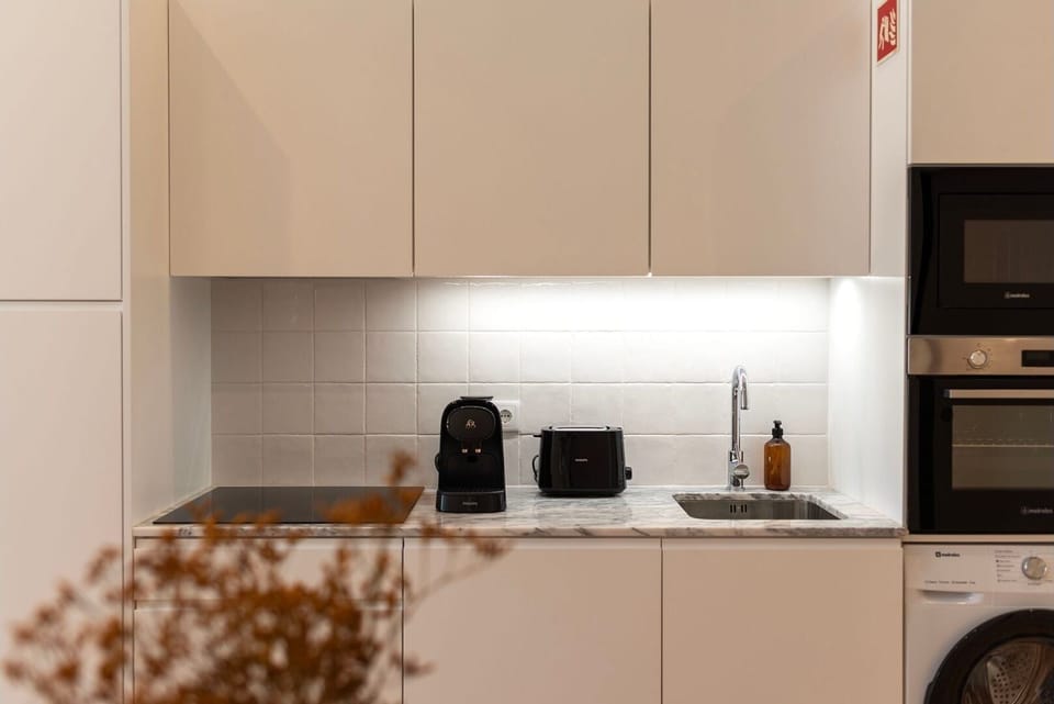 Despite its compact size, this kitchenette is fully equipped with everything you need to create culinary delights.