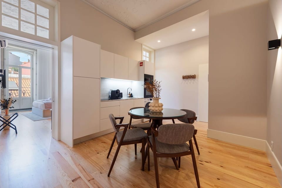 A sleek dining table, designed to accommodate intimate dinners or lively gatherings, takes center stage on this wonderful apartment.