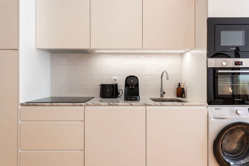 Despite its compact size, this kitchenette is fully equipped with everything you need to create culinary delights.