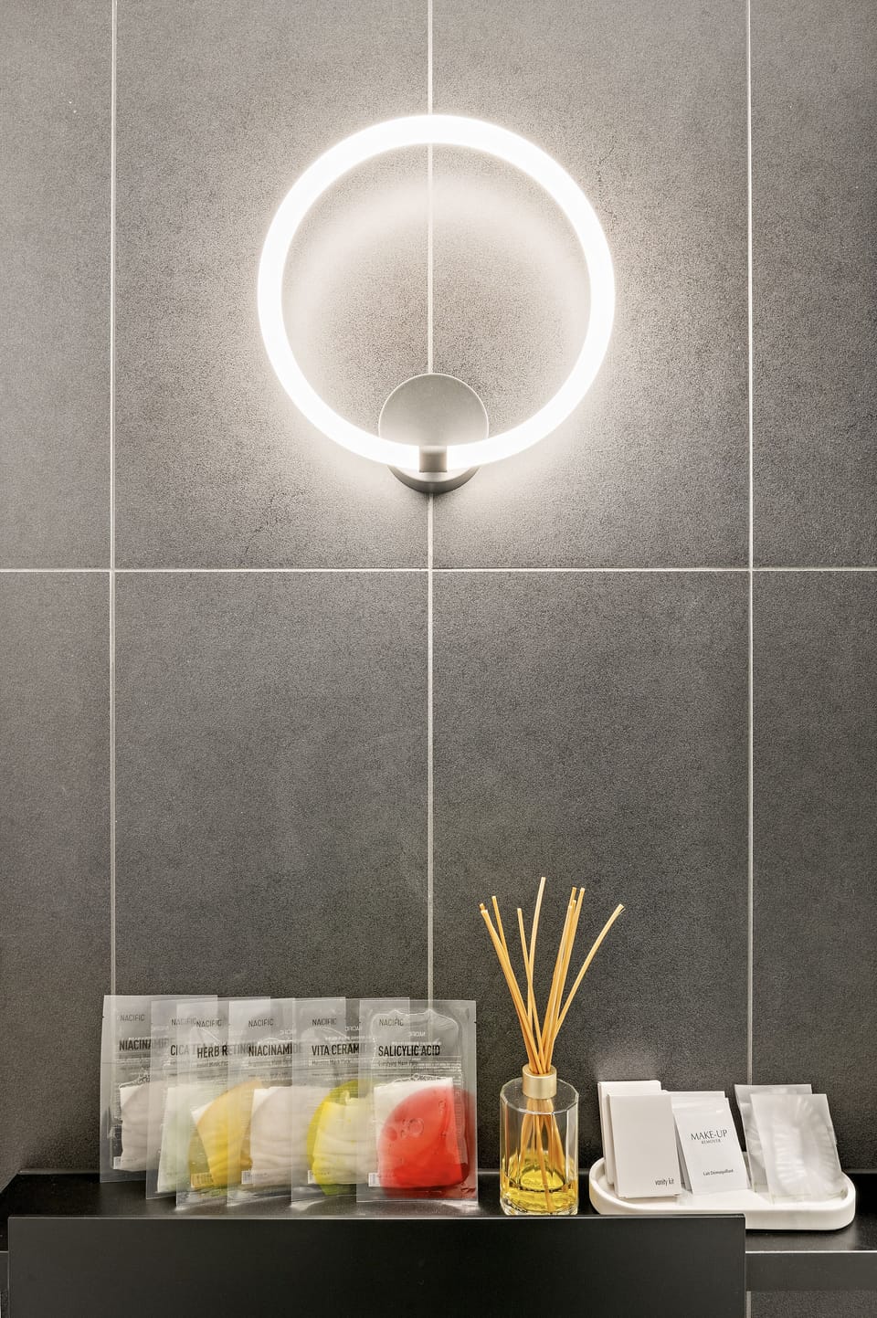 Bathroom equipped with facial masks, vanity kits, makeup removal and shower caps