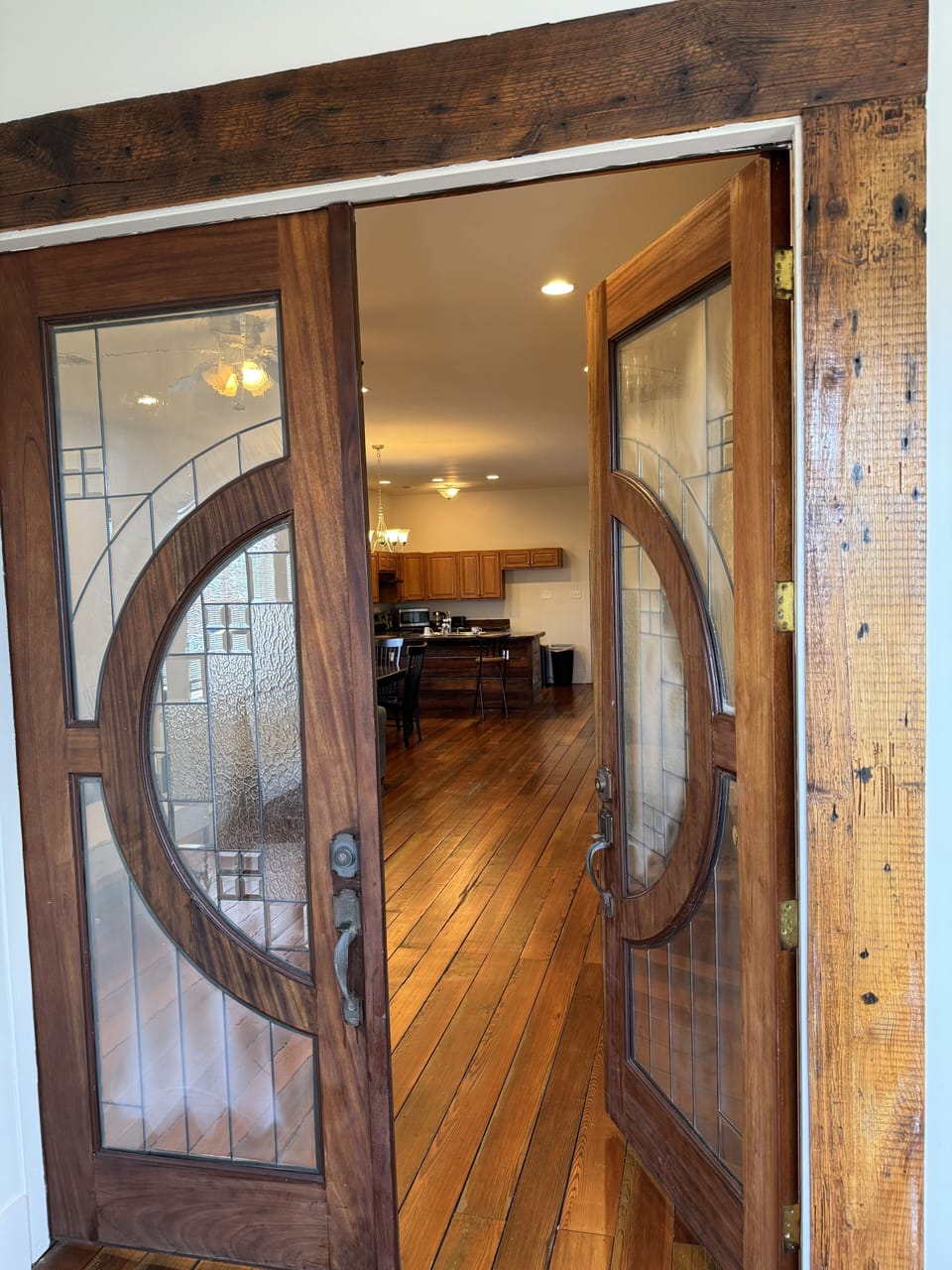 2nd level entry via foyer Mid century modern Cherry wood french doors