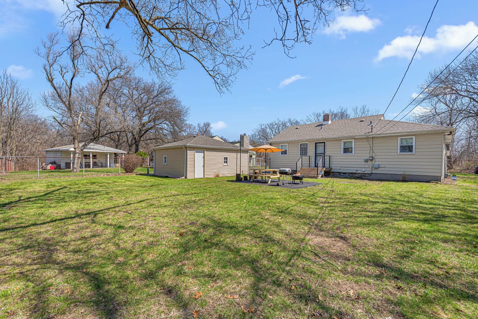 The large fenced-in yard provides plenty of room to run and enjoy nature.