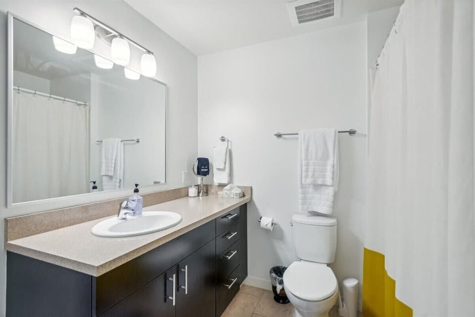 Bright, clean, and beautifully appointed—your private full bathroom is ready to refresh.