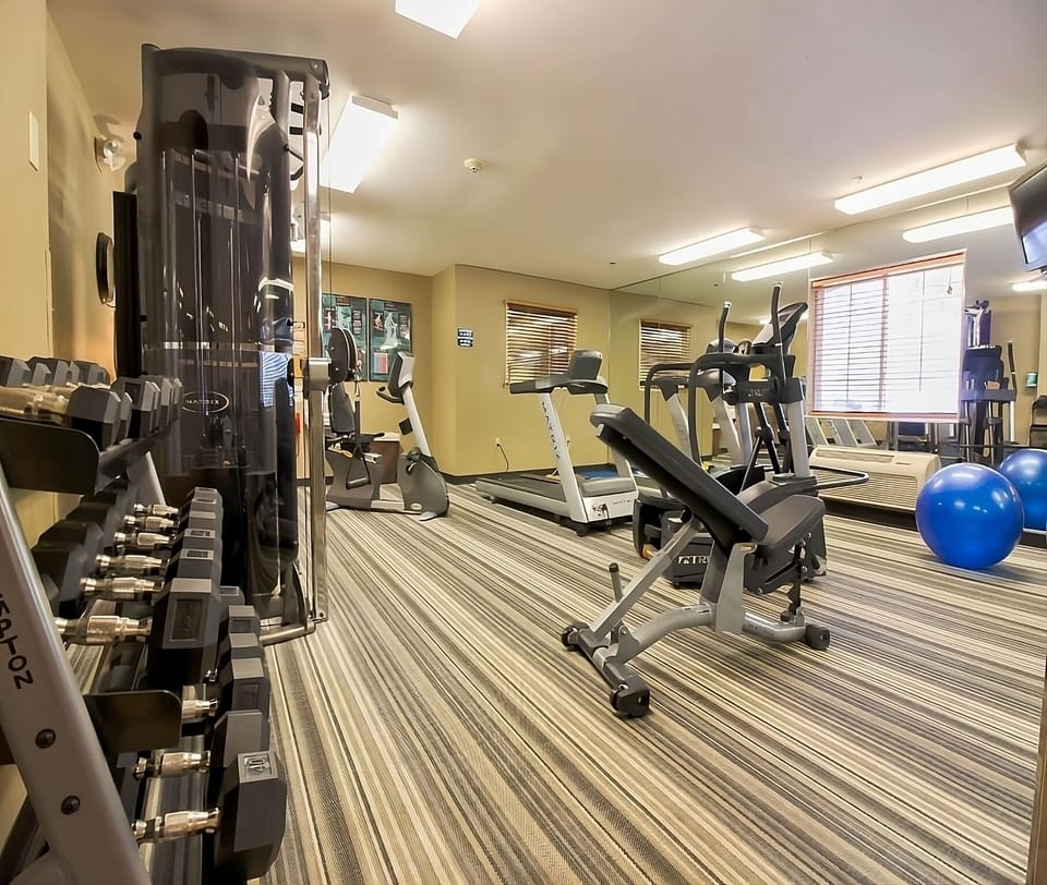 Recharge with a quick workout in the bright fitness room.