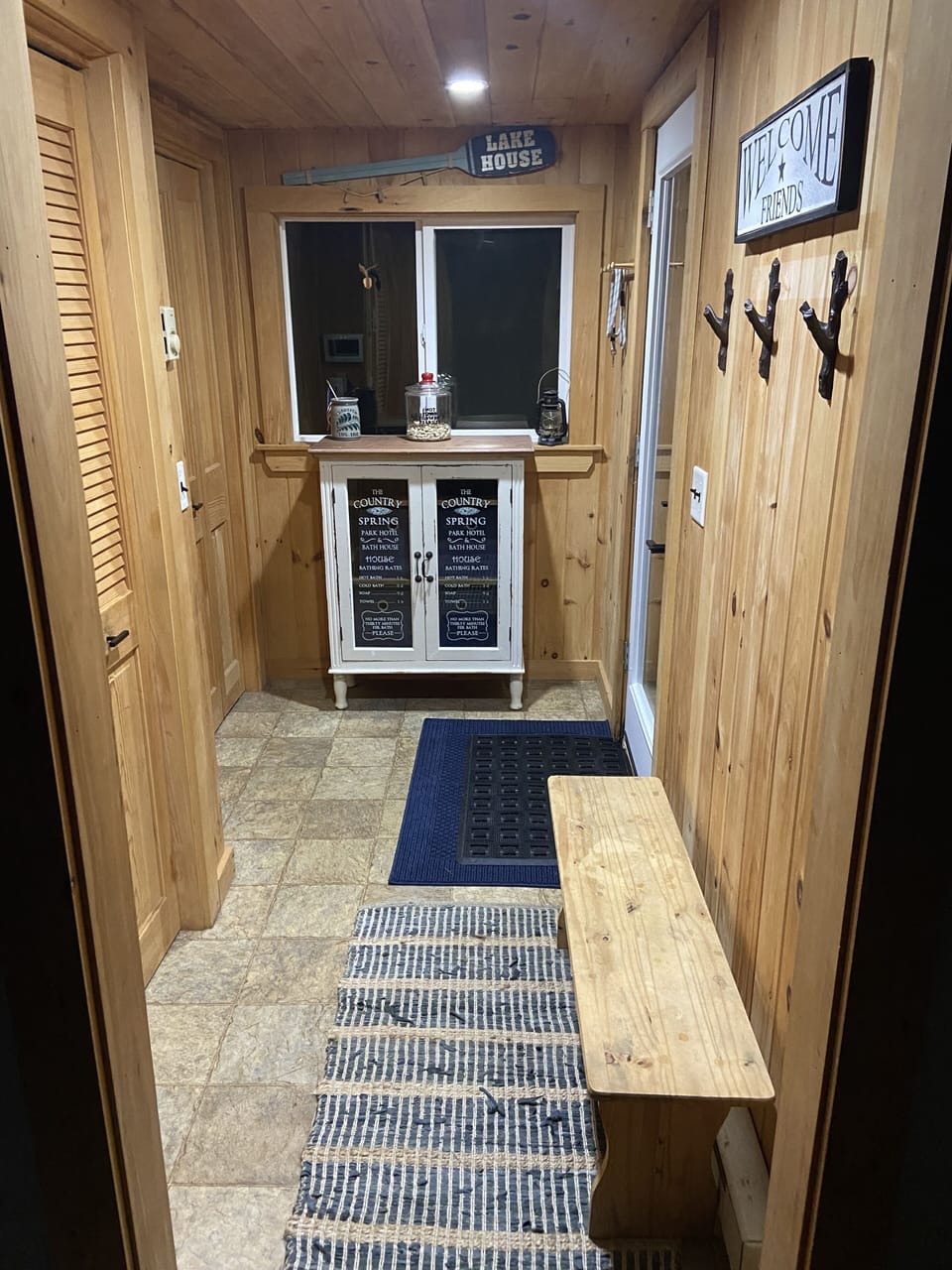Mudroom entry with storage space.