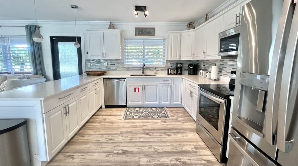 Large open kitchen fully stocked with everything needed for preparing a feast!