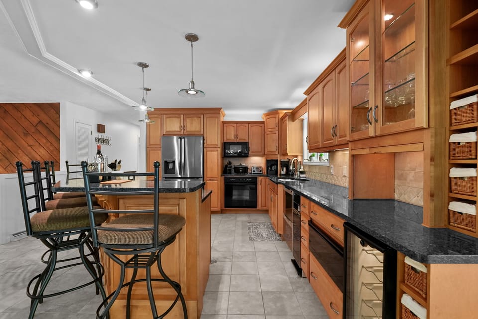 expansive granite counter tops, fully stocked kitchen, superior appliances. 