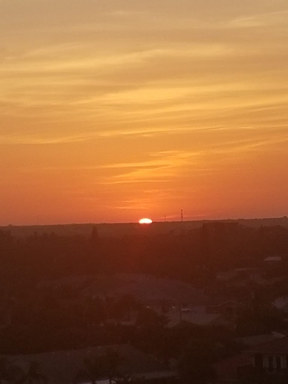 Sunset from front of building overlooking city