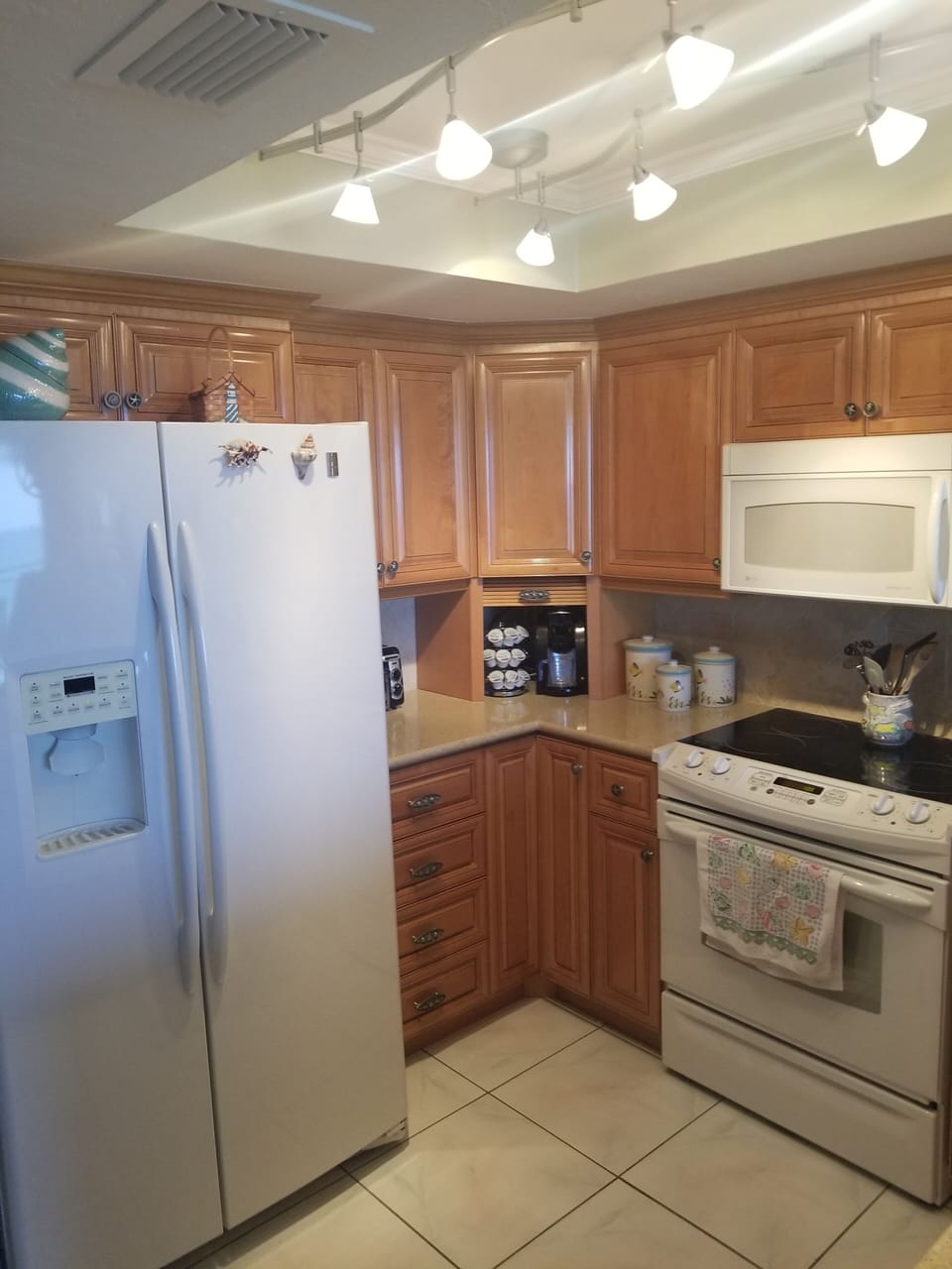kitchen is well stocked, keurig, pots, blender, dishes + + +