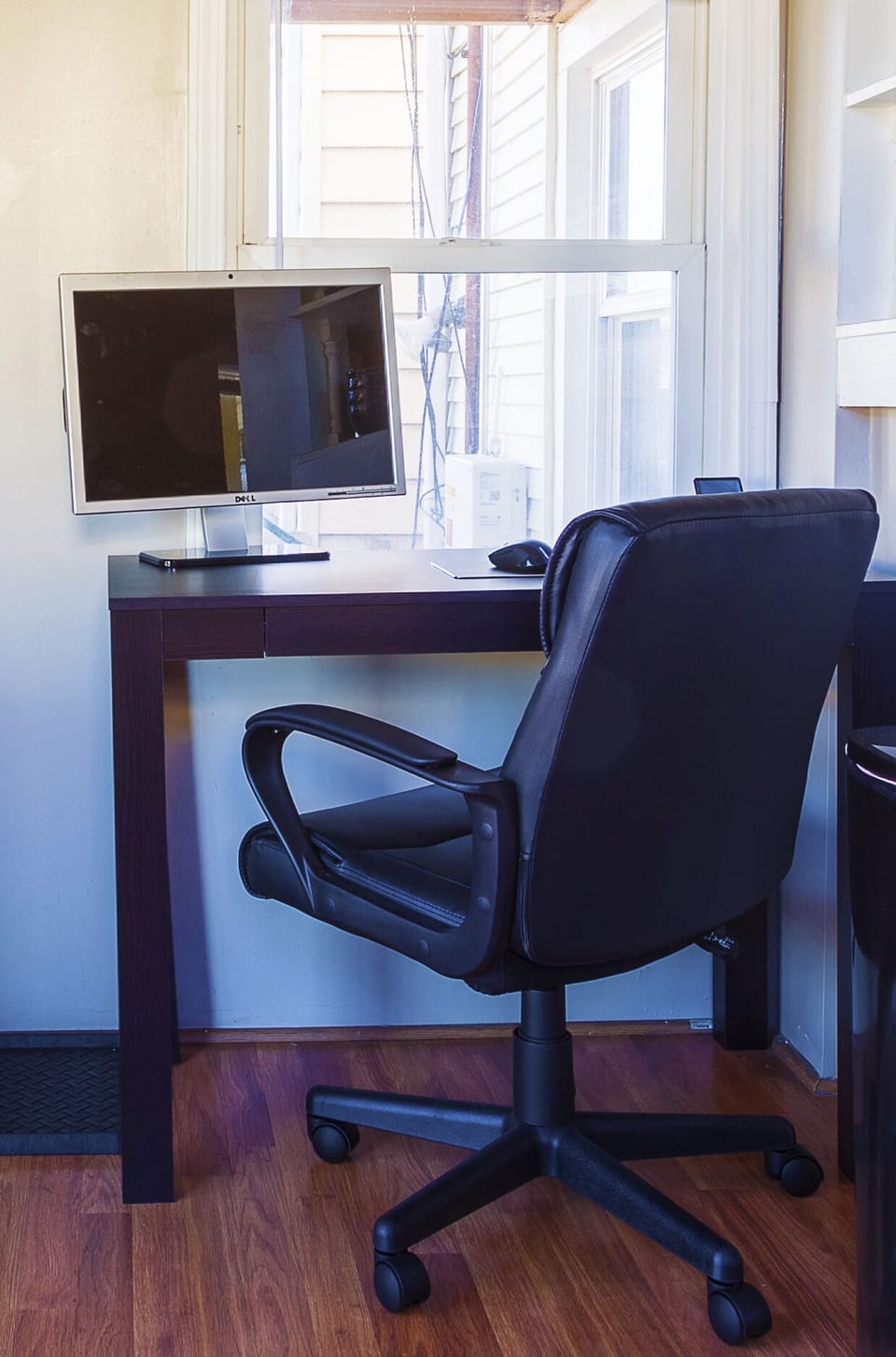 Large desk w/ergonomic chair.  Monitor, keyboard, mouse, in cabinet to the left