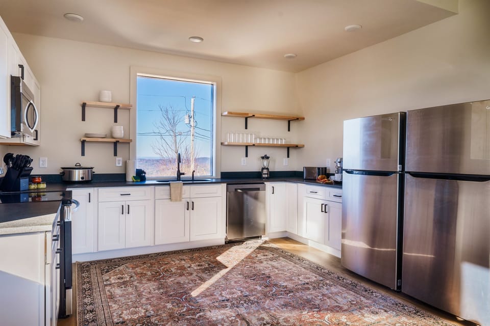 Open shelves and double fridges makes it convenient for everyone