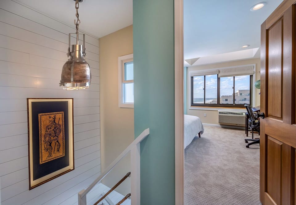 A unique interior window draws natural light throughout the entire apartment.