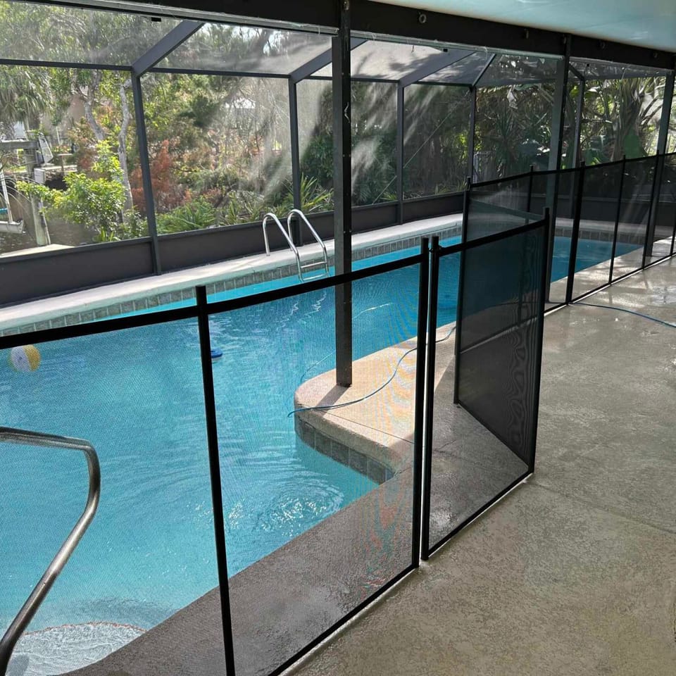 Pool view showing pool fencing for guest safety. 