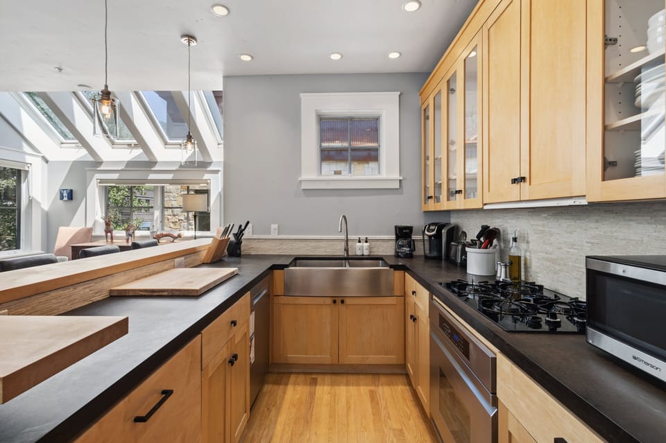 Chef's kitchen with generous counter space, perfect for cooking, hosting friends, and gathering with family—fully equipped for all your culinary needs.