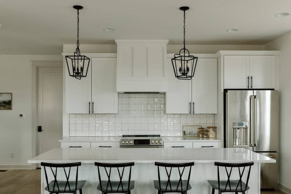 Level 1: Gourmet Kitchen Featuring GE Cafe Appliances and Electric Stove