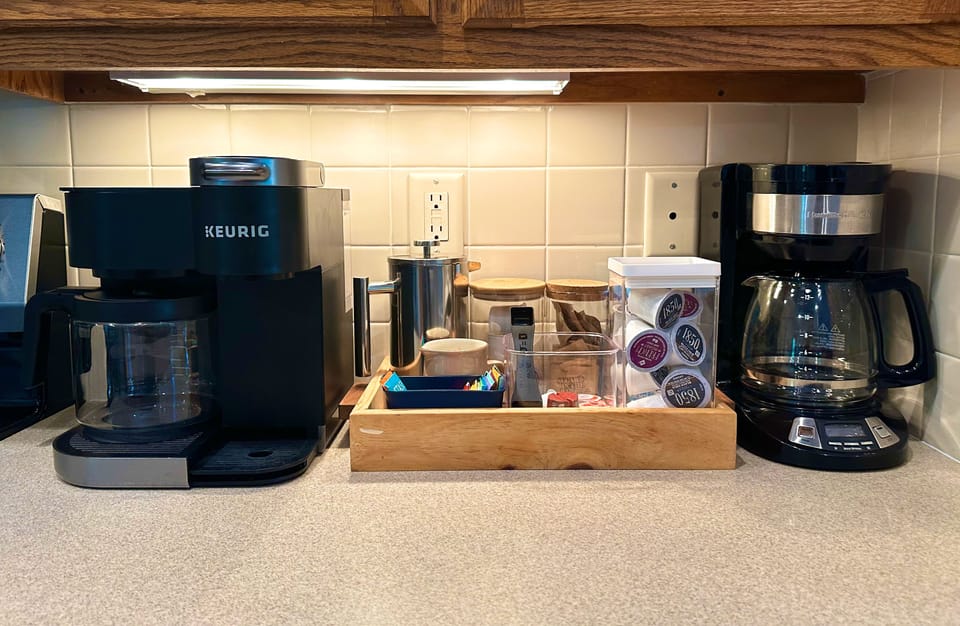 French press, Keurig, and drip coffee maker plus tea kettles, coffee and tea