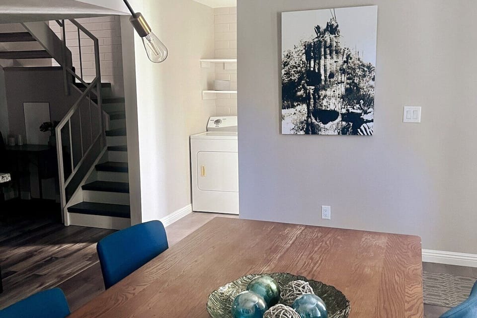 view of stairs leading upstairs and laundry room