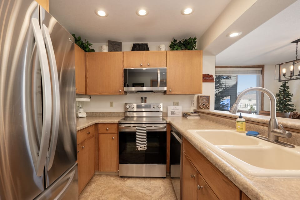 - Kitchen with stainless steel appliances and sink   - Wooden cabinetry and functional cooking space   - Fully equipped for preparing meals during your stay