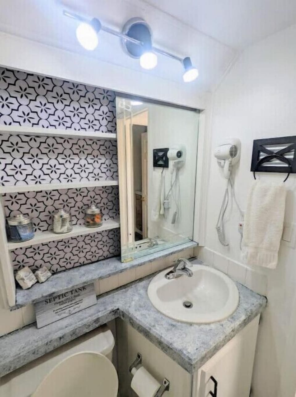 Bathroom is stocked with towels and toiletries 