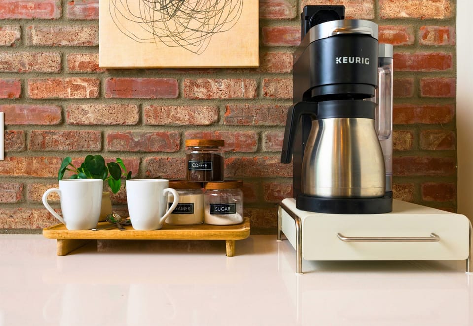 A well-appointed coffee station with all the essentials, perfect for preparing a quick meal or snack during your stay.
