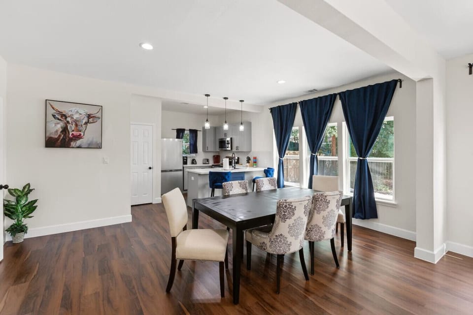 Dining area sits directly beside the kitchen, making shared meals and group gatherings easy and convenient.