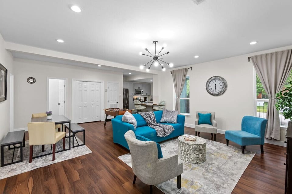 Second living area with cozy seating and open flow into the dining space — enjoy two full living rooms for extra comfort and flexibility.