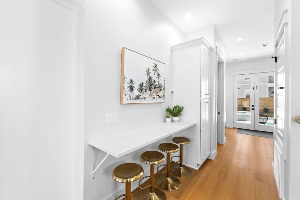 The bar height counter and stools offer additional seating.