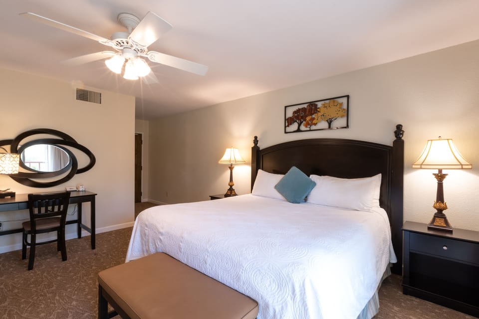 Wake refreshed in a serene bedroom with dedicated vanity workspace.
