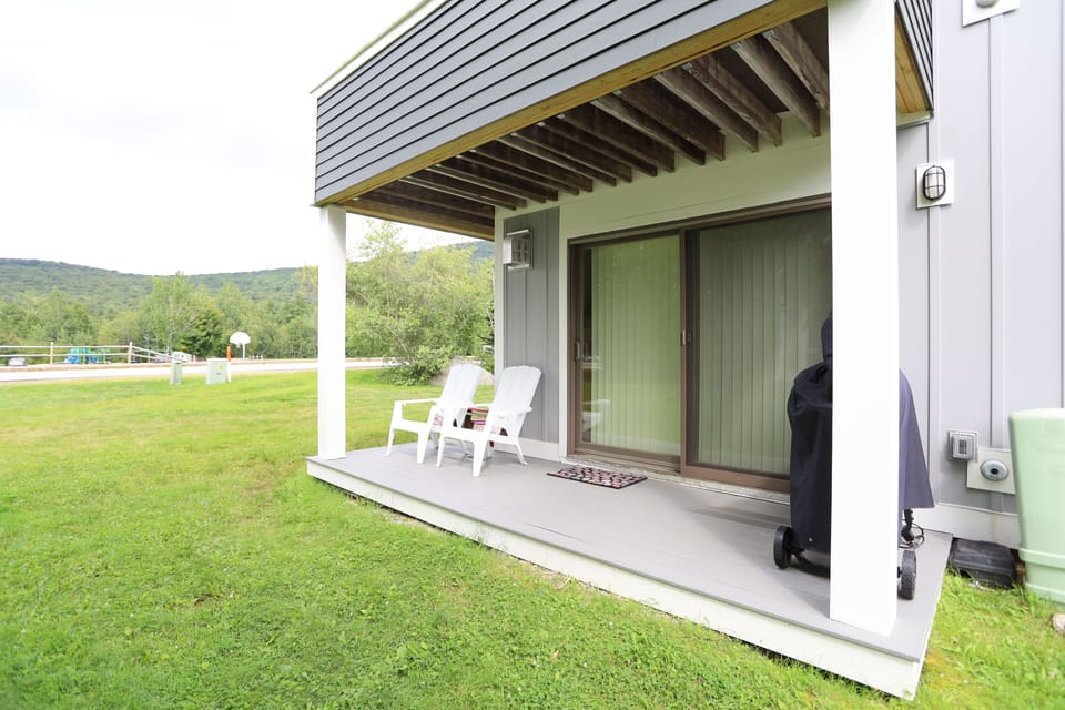 Patio with Grill and Open Lawn in Condo by Town Square