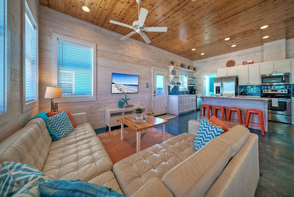Inviting cozy couch and a large TV awaits.