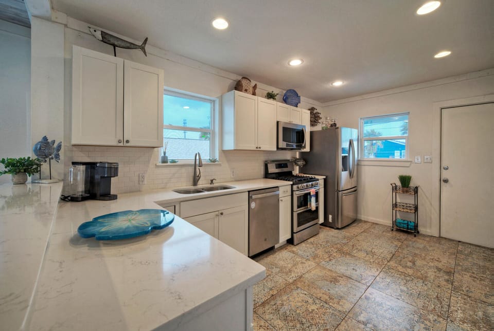 Spacious countertops and modern kitchen appliances.