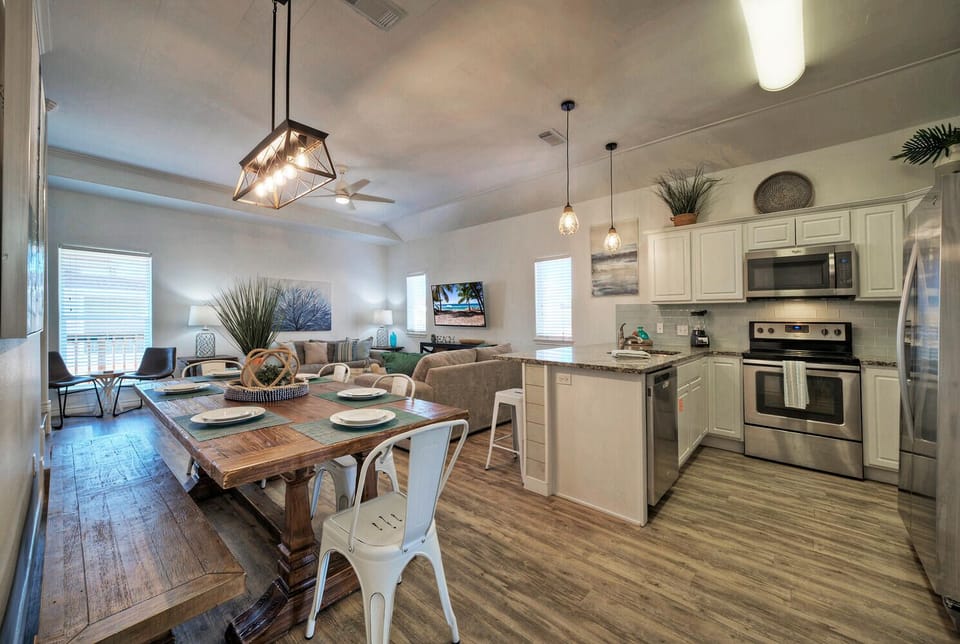 Seamless elegance: Modern kitchen and dining fusion.