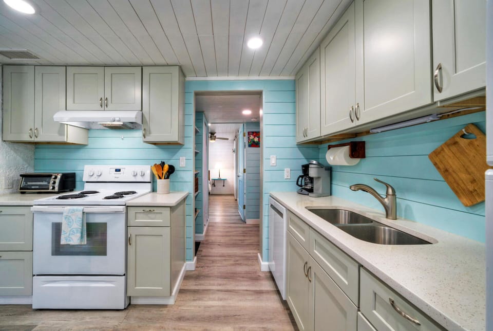 Modern kitchen appliances to match the spacious countertops.