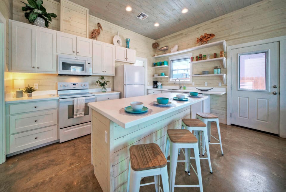 Spacious kitchen and expansive kitchen island.