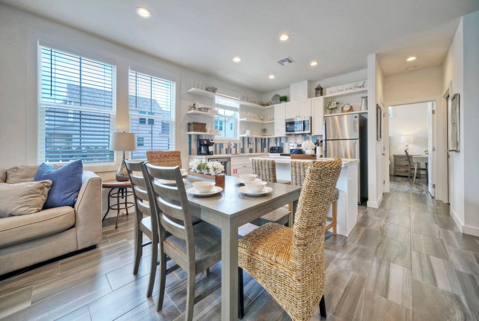 Dining table features four chairs and bench seating.