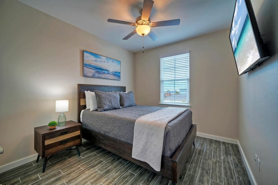 Bedroom 2 features a Queen bed.