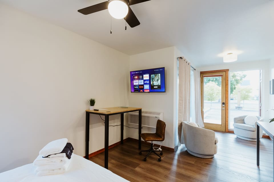 [Living area] Sit back and enjoy a movie on our Roku smart TV, which swivels so you can watch your favorite Netflix shows while you eat breakfast!