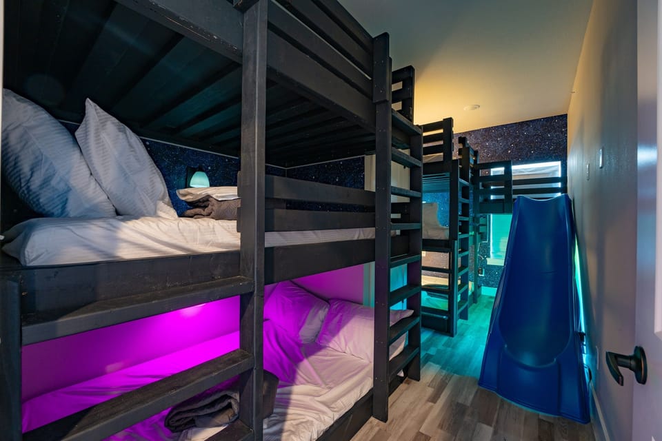 Let the kids have their own nightly bunk party with glowing LED lights and built-in wall lighting for each bed