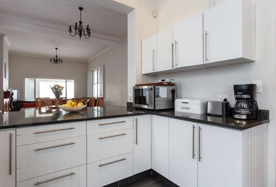 This is the coffee station side of the kitchen as well as a lovely large counter space in which to serve dinner, to the dining table just on the other side.