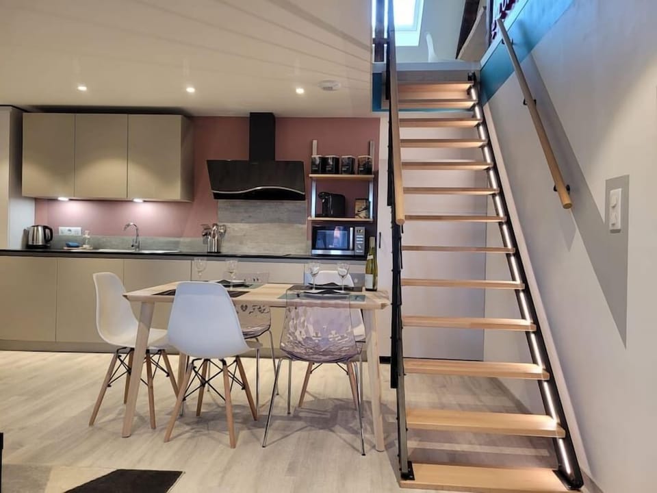 Kitchen + dining area and access to the mezzanine