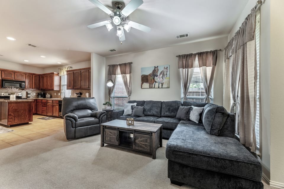 Enjoy movie nights on the 65” TV or relax in the recliner