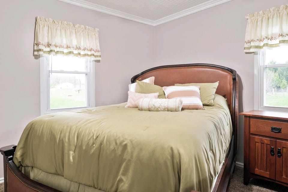 Queen Bed on main floor near bathroom