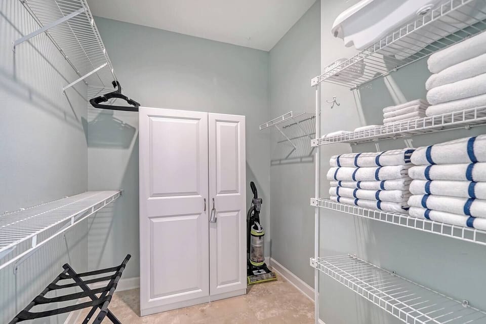 Feel right at home in our Primary Bedroom walk-in closet, offering abundant space for your belongings, ensuring a comfortable and organized stay.