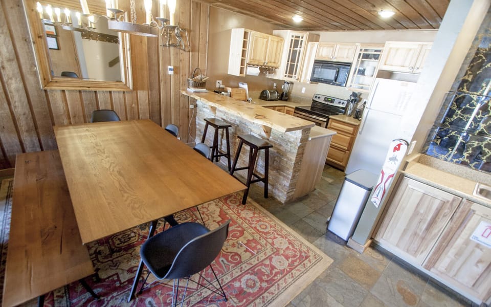 Large dining room table and plenty of seating.