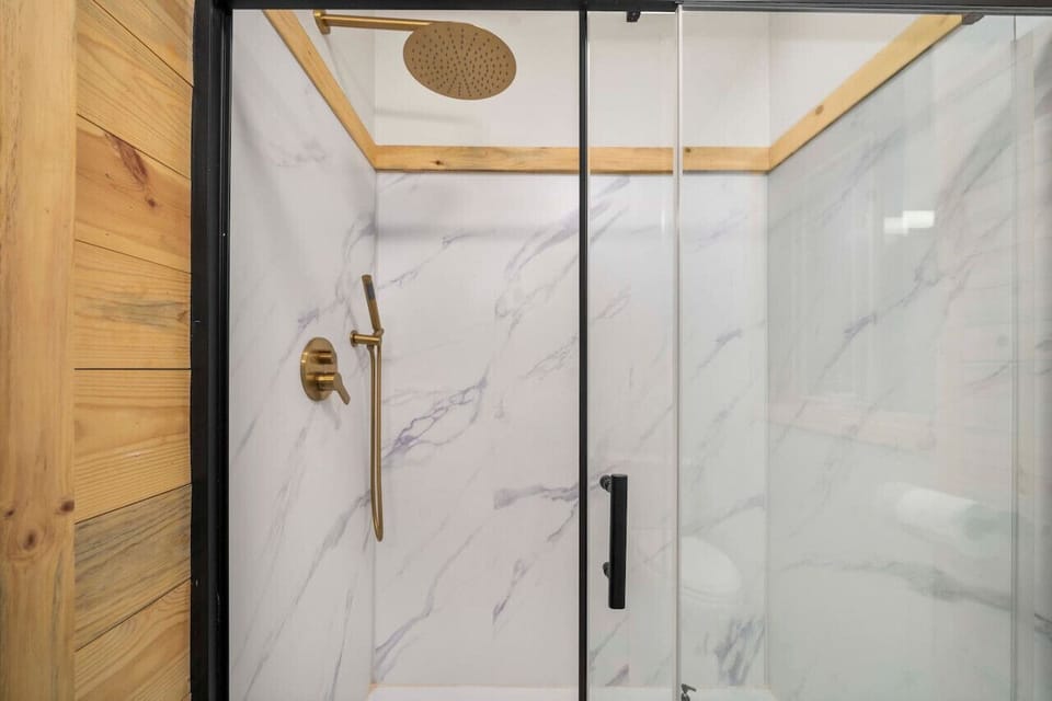 Enjoy our marble-adorned bathroom, where every detail offers relaxation and luxury.