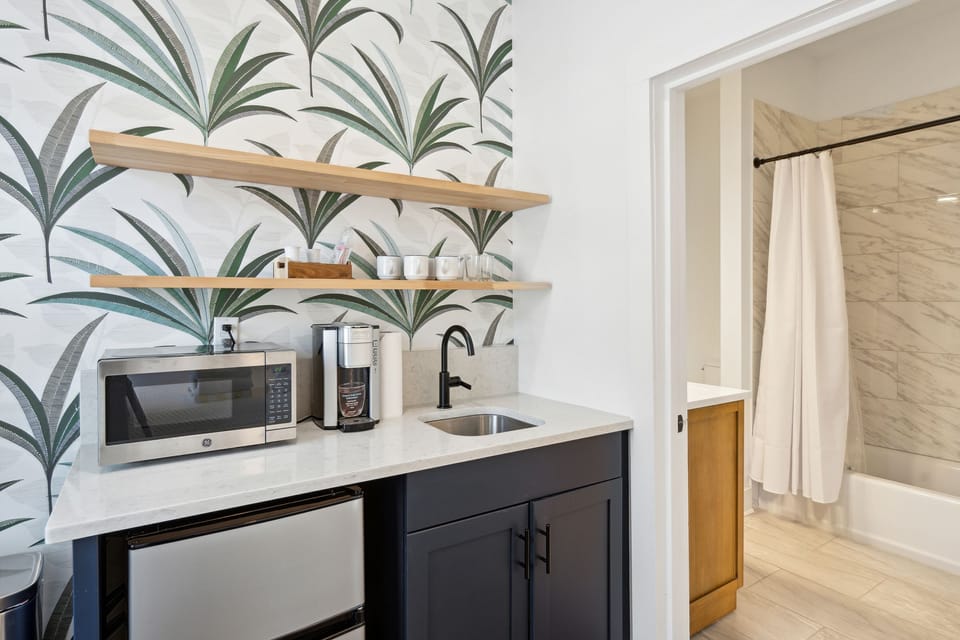 Microwave, Mini-fridge, Coffee station, & Bathroom Entrance