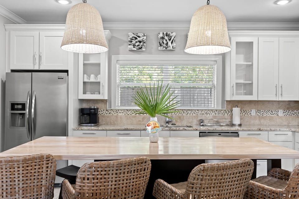 A spacious kitchen island with comfy stools, perfect for cooking, dining, and conversations.