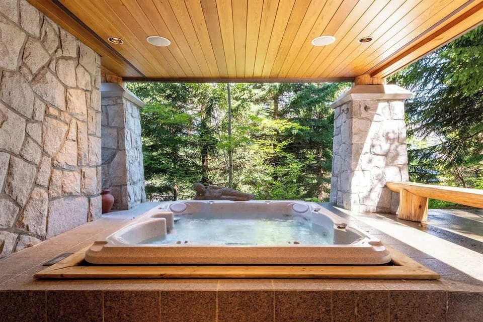 - Covered outdoor hot tub surrounded by forest views and mountain air  
- Perfect spot to unwind after skiing or exploring scenic trails  
- Serene retreat offering privacy and year-round relaxation  
