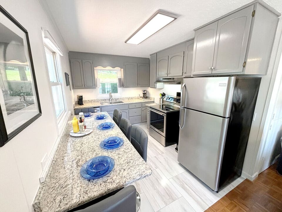 Bright kitchen with essentials for home-cooked meals and gatherings.